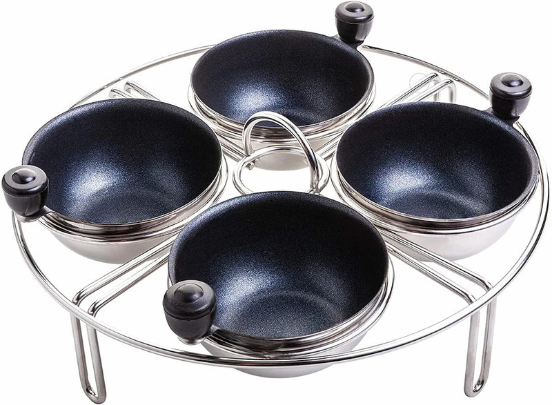 Stainless steel 4-cup egg poacher rack with nonstick cups and black knobs, perfect for stovetop cooking.