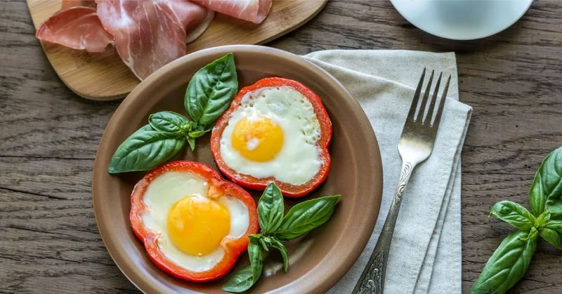 Poached Eggs On A Bed Of Colorful Peppers