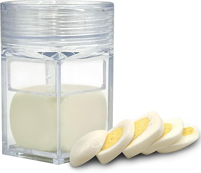 Transparent egg cuber mold holding a hard-boiled egg with neatly sliced cubed egg pieces displayed.