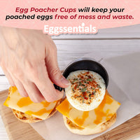 Hand using Egg Poacher Spare Removable Poaching Cup to place poached egg on cheesy breakfast muffin.